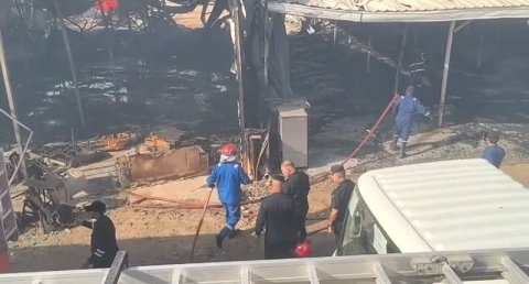 الدفاع المدني يخمد حريقاً في معرض مزاد سوق سفوان غ